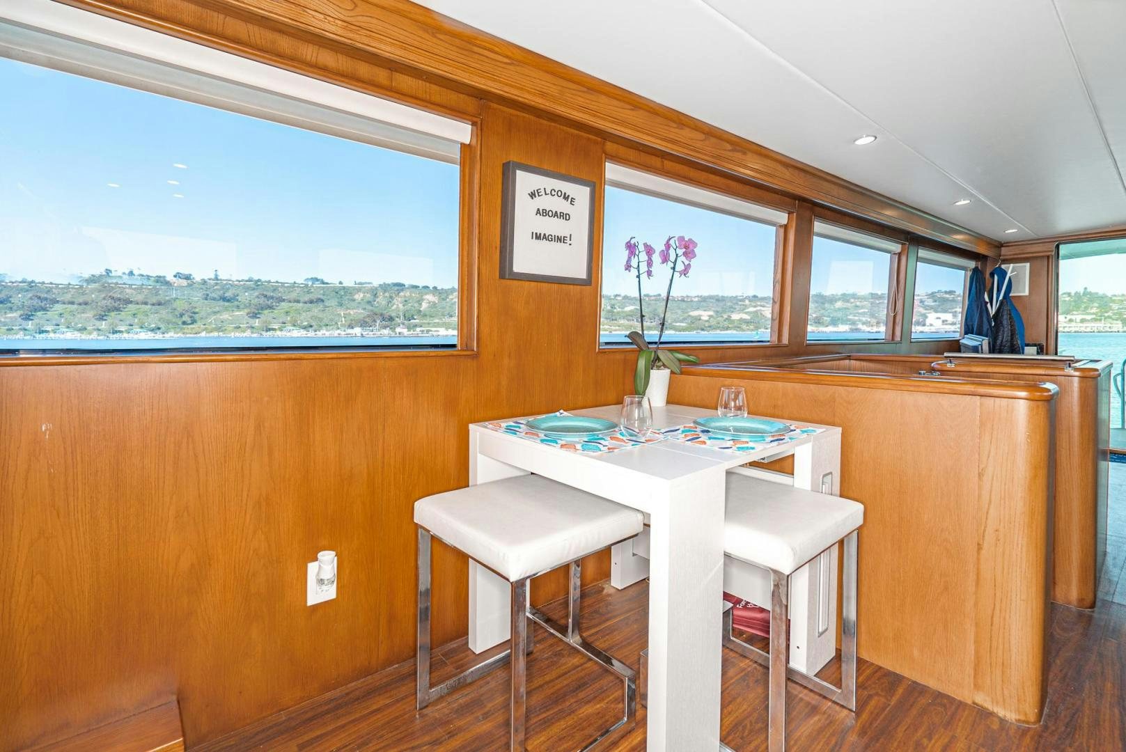 a table and chairs in a room aboard IMAGINE Yacht for Sale