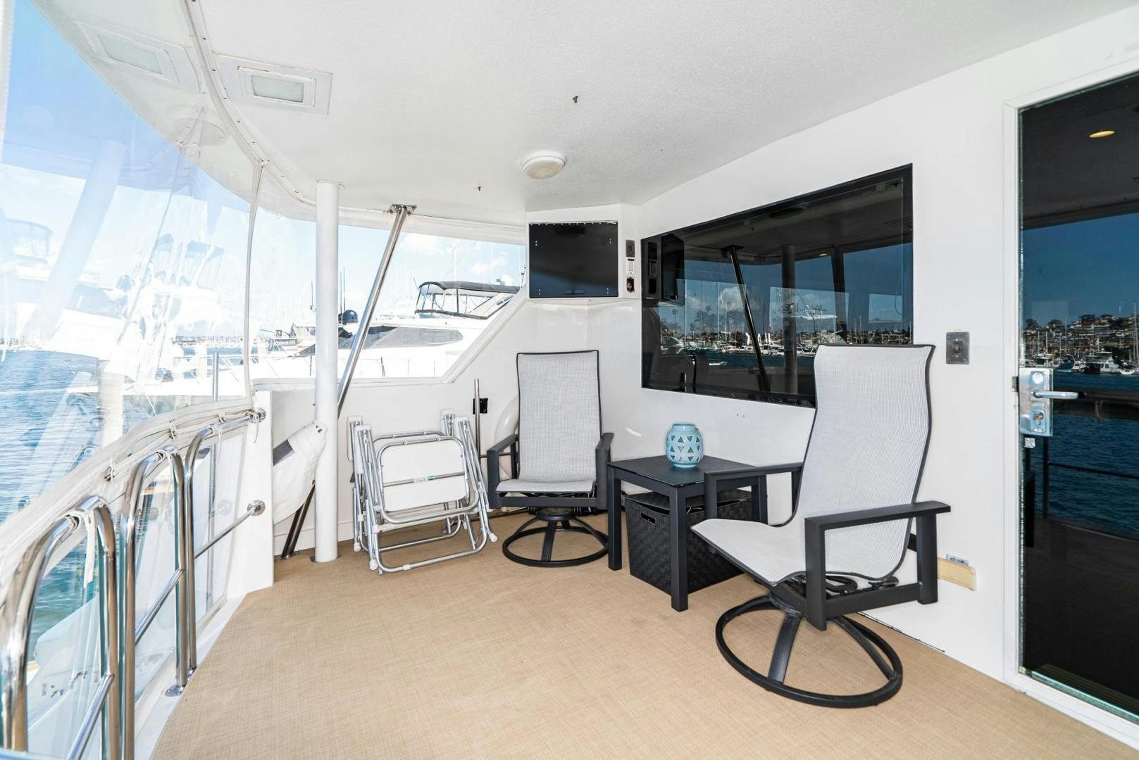 a room with a table and chairs aboard IMAGINE Yacht for Sale