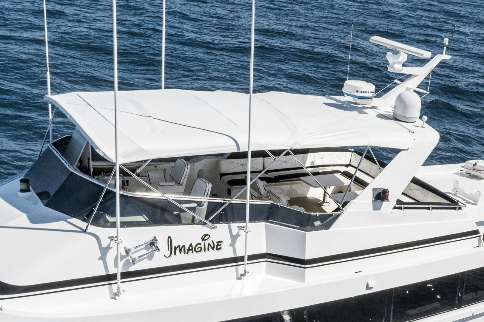 a white boat in the water aboard IMAGINE Yacht for Sale
