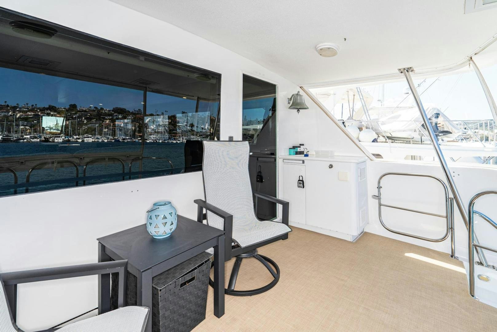 a room with a table and chairs aboard IMAGINE Yacht for Sale
