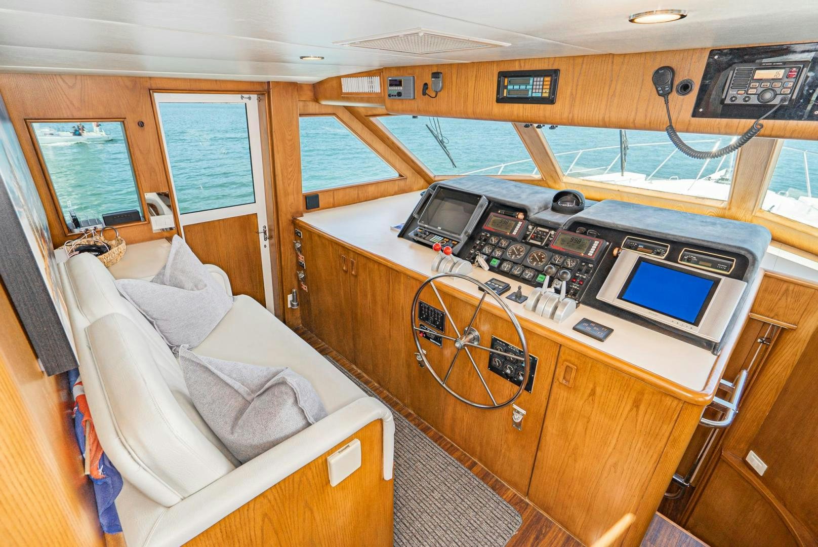 a boat with a bed and a laptop on it aboard IMAGINE Yacht for Sale