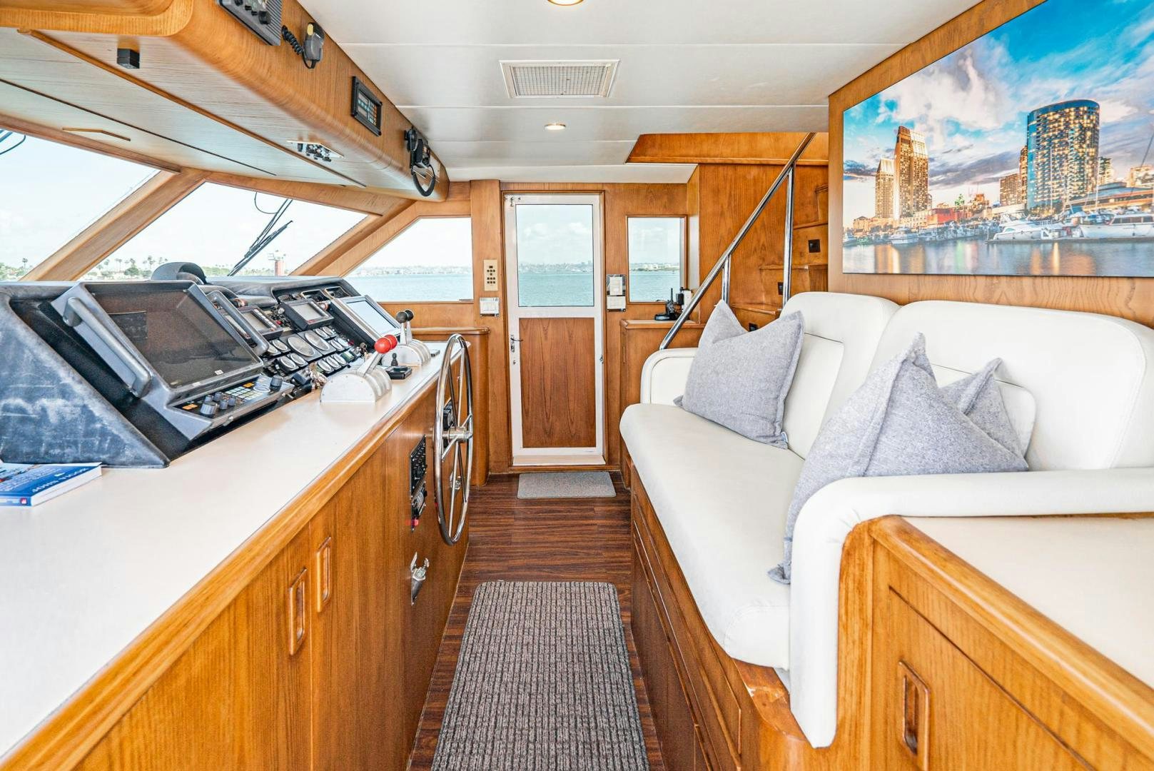 a bedroom with a bed and a piano aboard IMAGINE Yacht for Sale