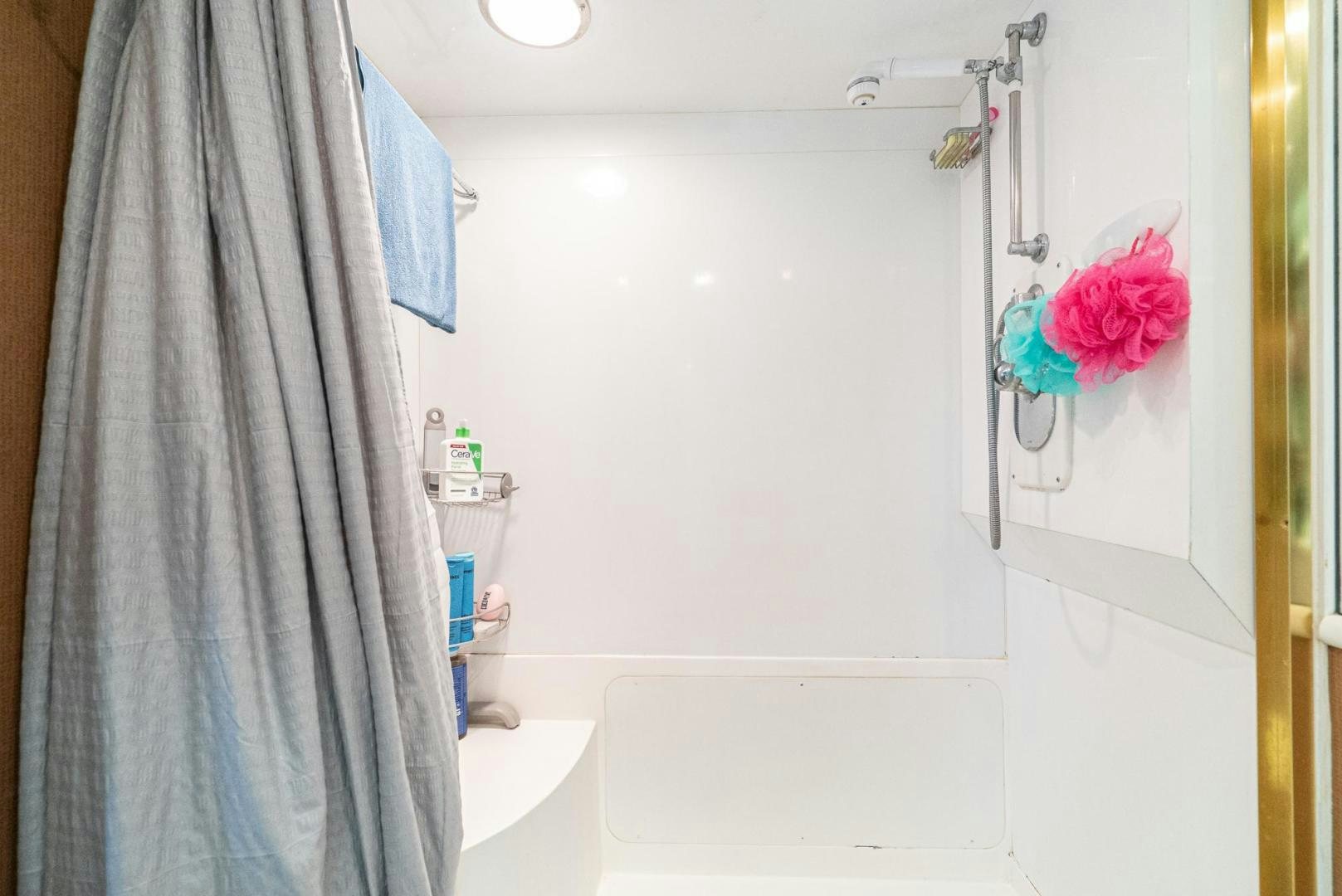 a bathroom with a flower from the wall aboard IMAGINE Yacht for Sale