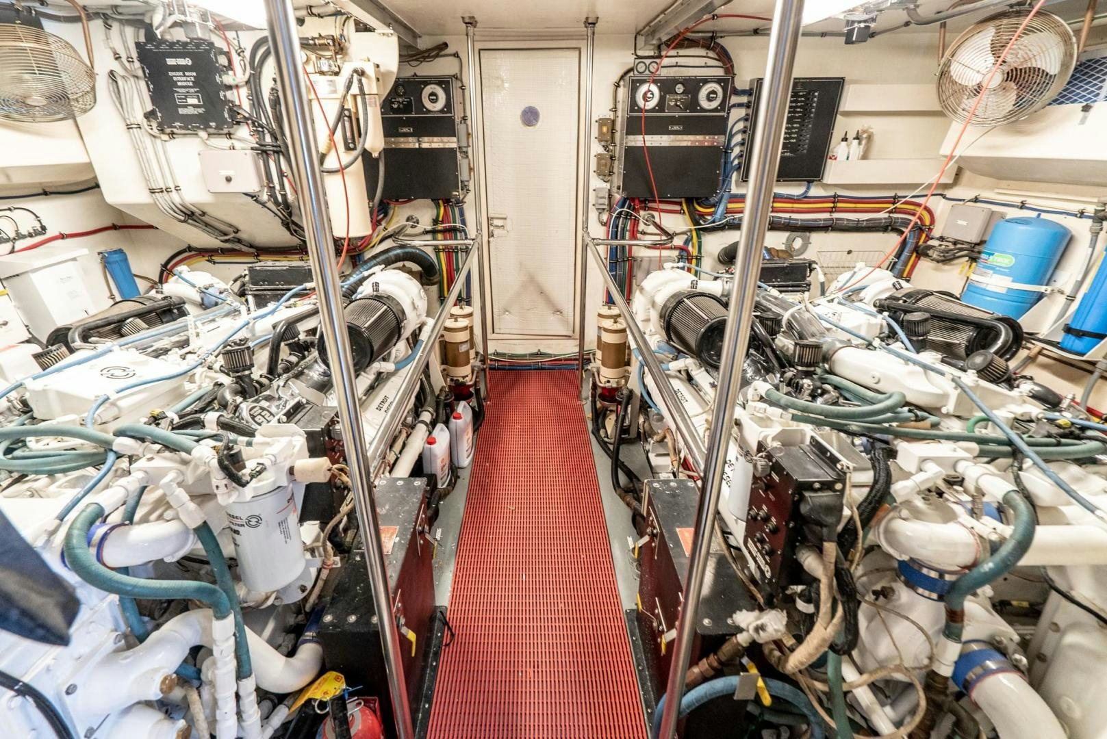 a room with many pipes and machinery aboard IMAGINE Yacht for Sale