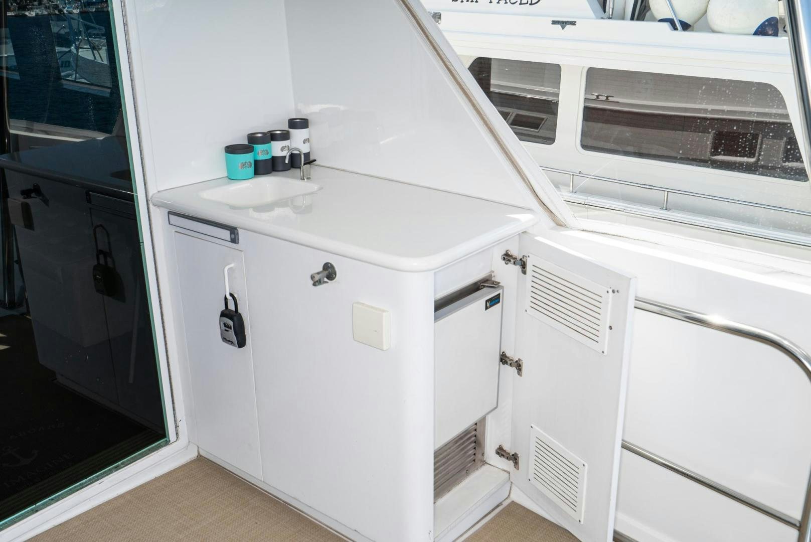 a white cabinet with drawers aboard IMAGINE Yacht for Sale