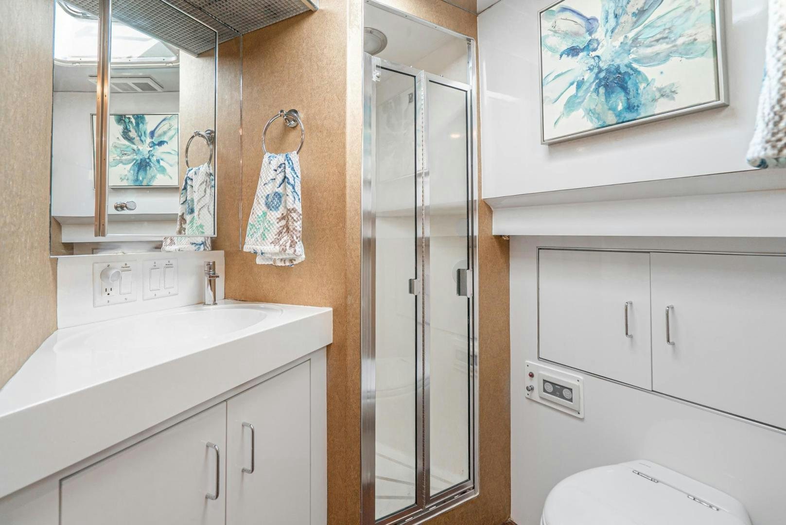 a bathroom with a shower unit and sink aboard IMAGINE Yacht for Sale