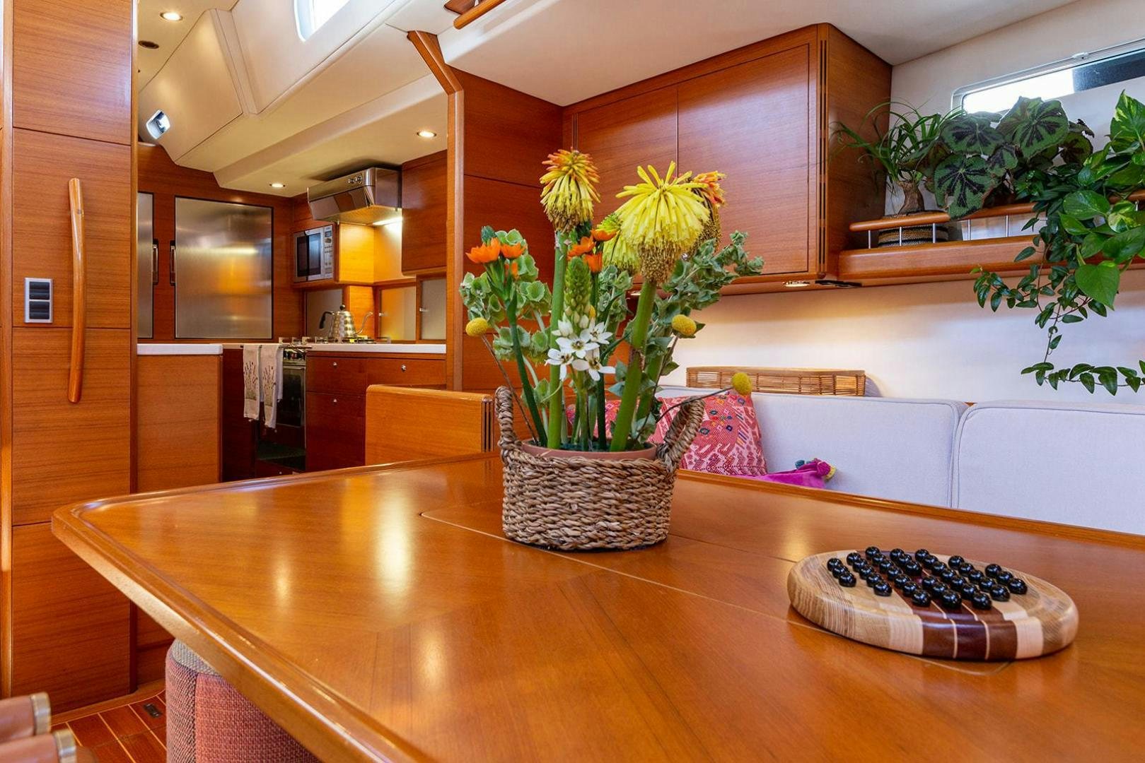 a table with a plant on it aboard FRIDA Yacht for Sale
