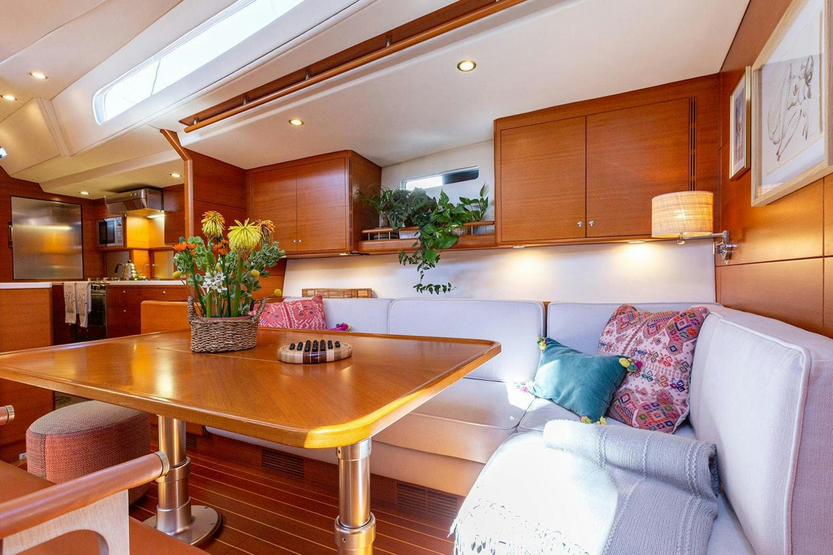 a living room with a table and couches aboard FRIDA Yacht for Sale