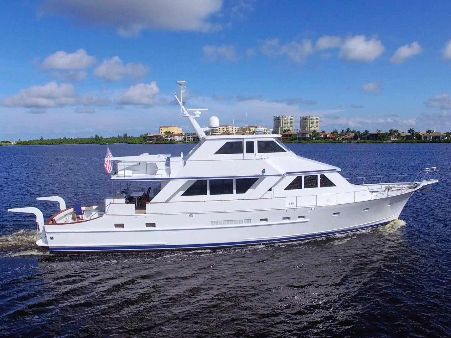 a white boat on the water aboard PENDANA Yacht for Sale