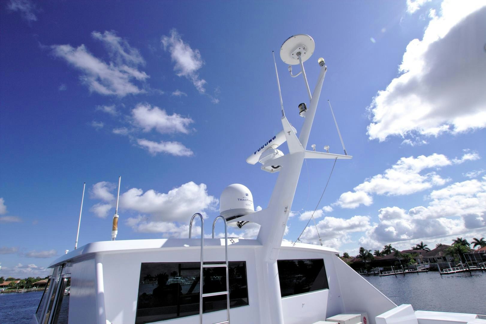 a white boat with a satellite dish on it aboard PENDANA Yacht for Sale