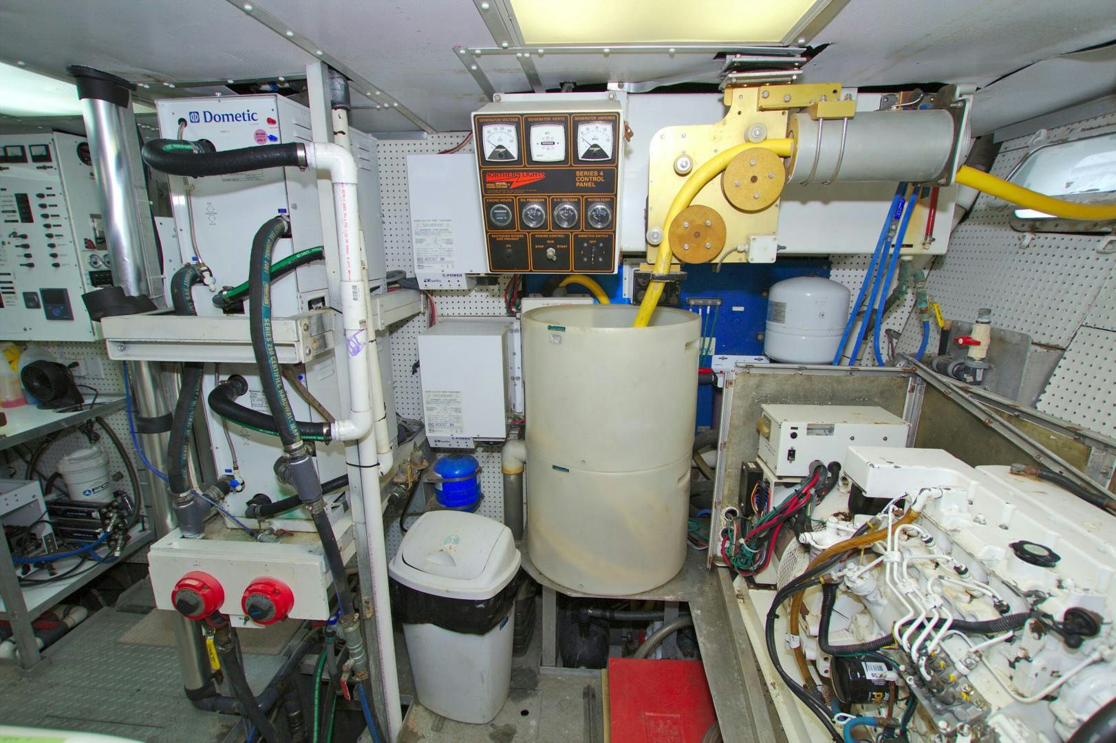 a room with machinery and pipes aboard PENDANA Yacht for Sale