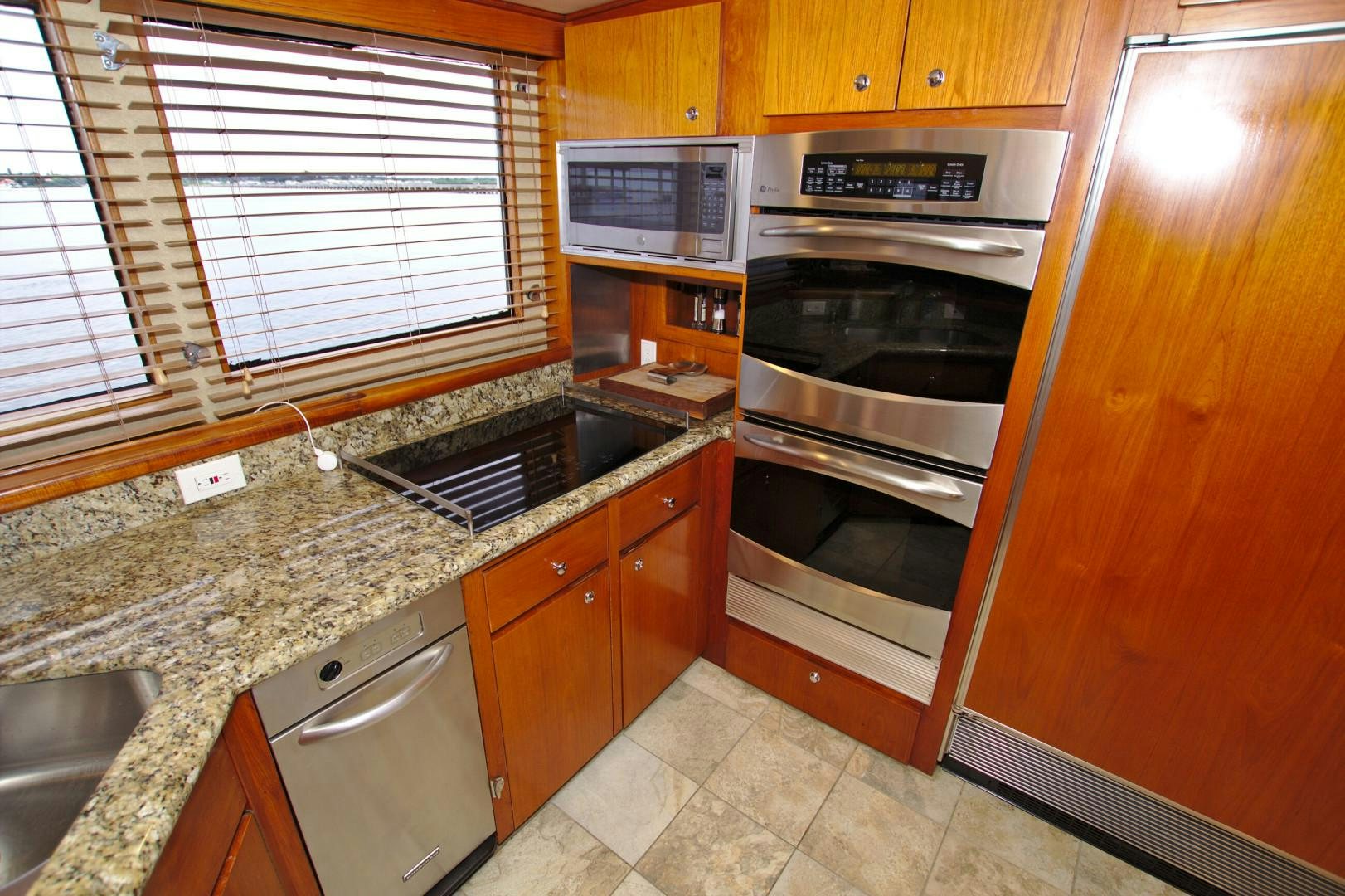a kitchen with a stove and oven aboard PENDANA Yacht for Sale