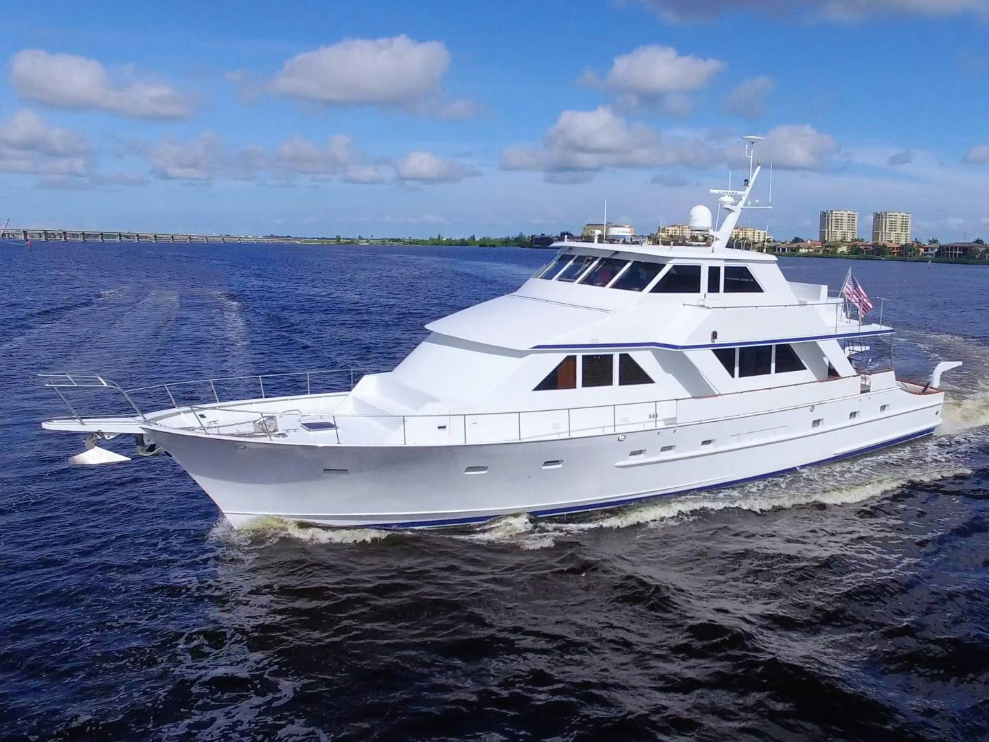 a white yacht on the water aboard PENDANA Yacht for Sale