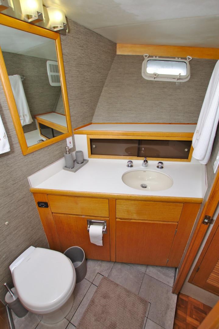 a bathroom with a sink and a toilet aboard PENDANA Yacht for Sale