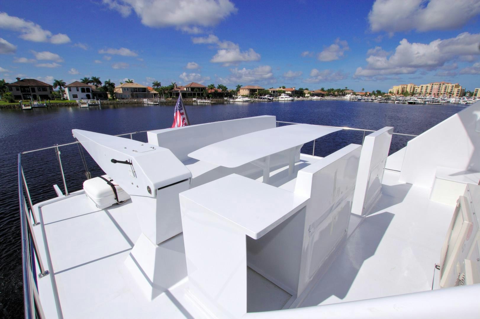a white boat on a body of water aboard PENDANA Yacht for Sale