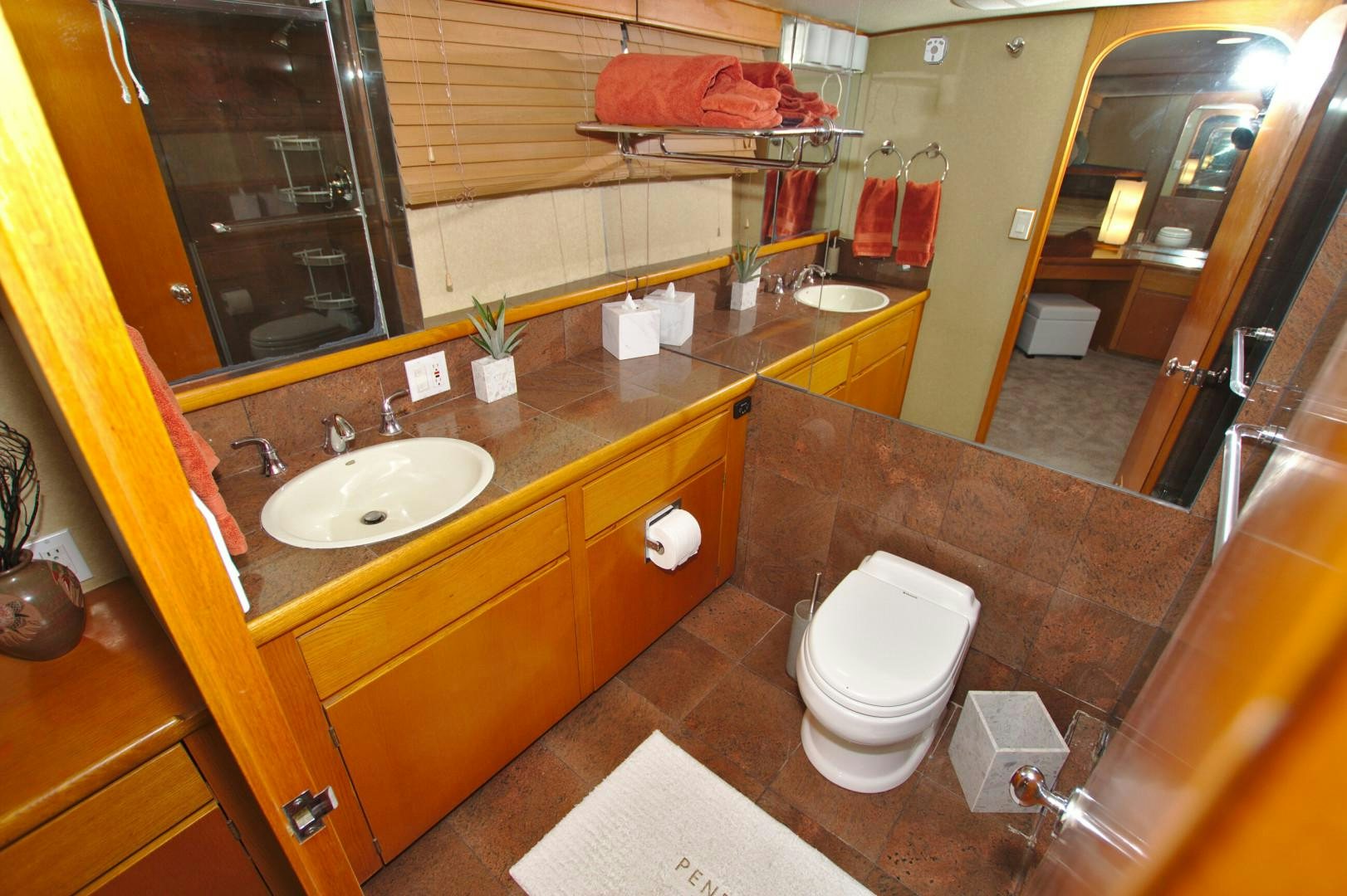 a bathroom with a large mirror aboard PENDANA Yacht for Sale