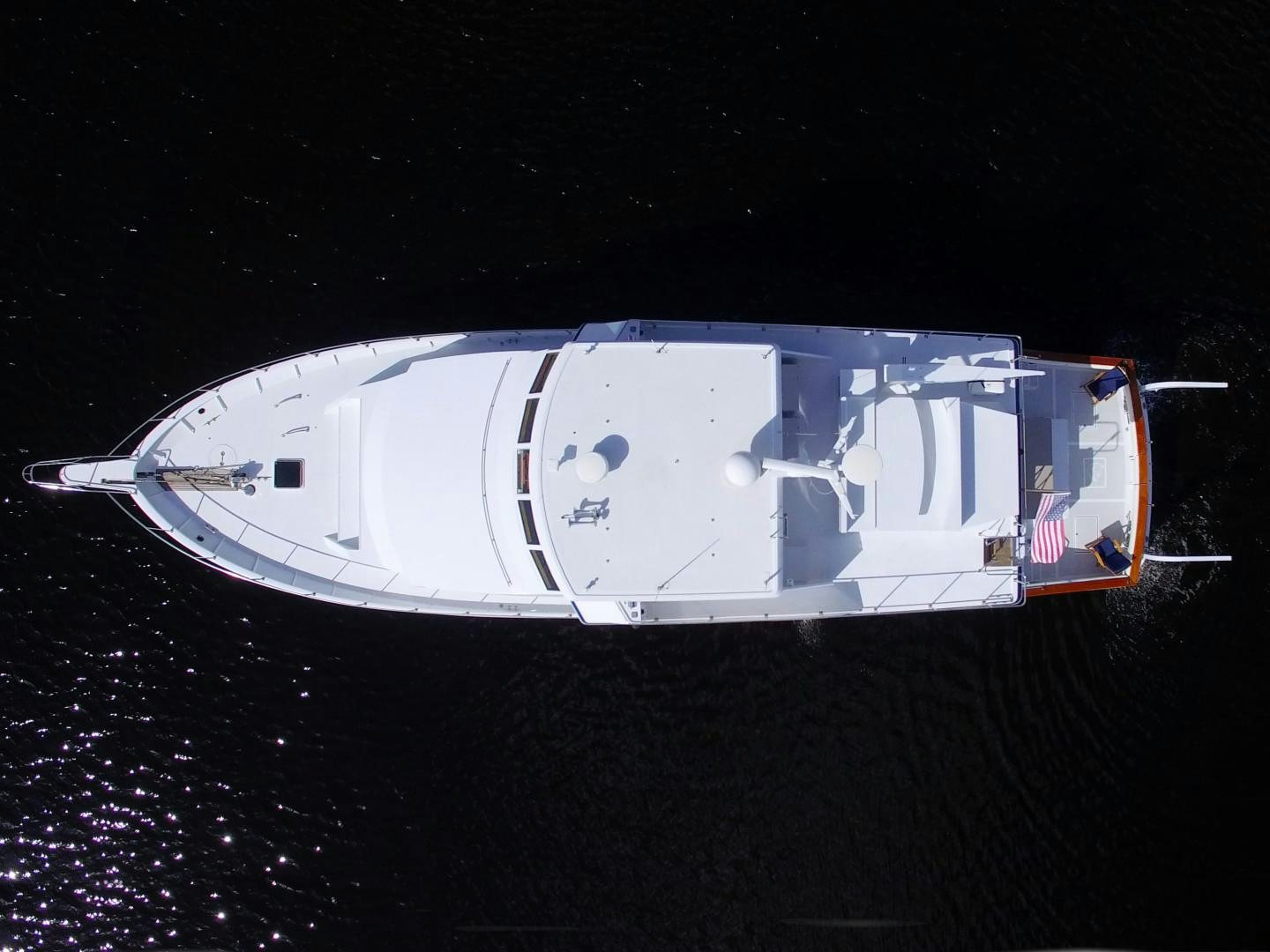a white and red logo on a black background aboard PENDANA Yacht for Sale