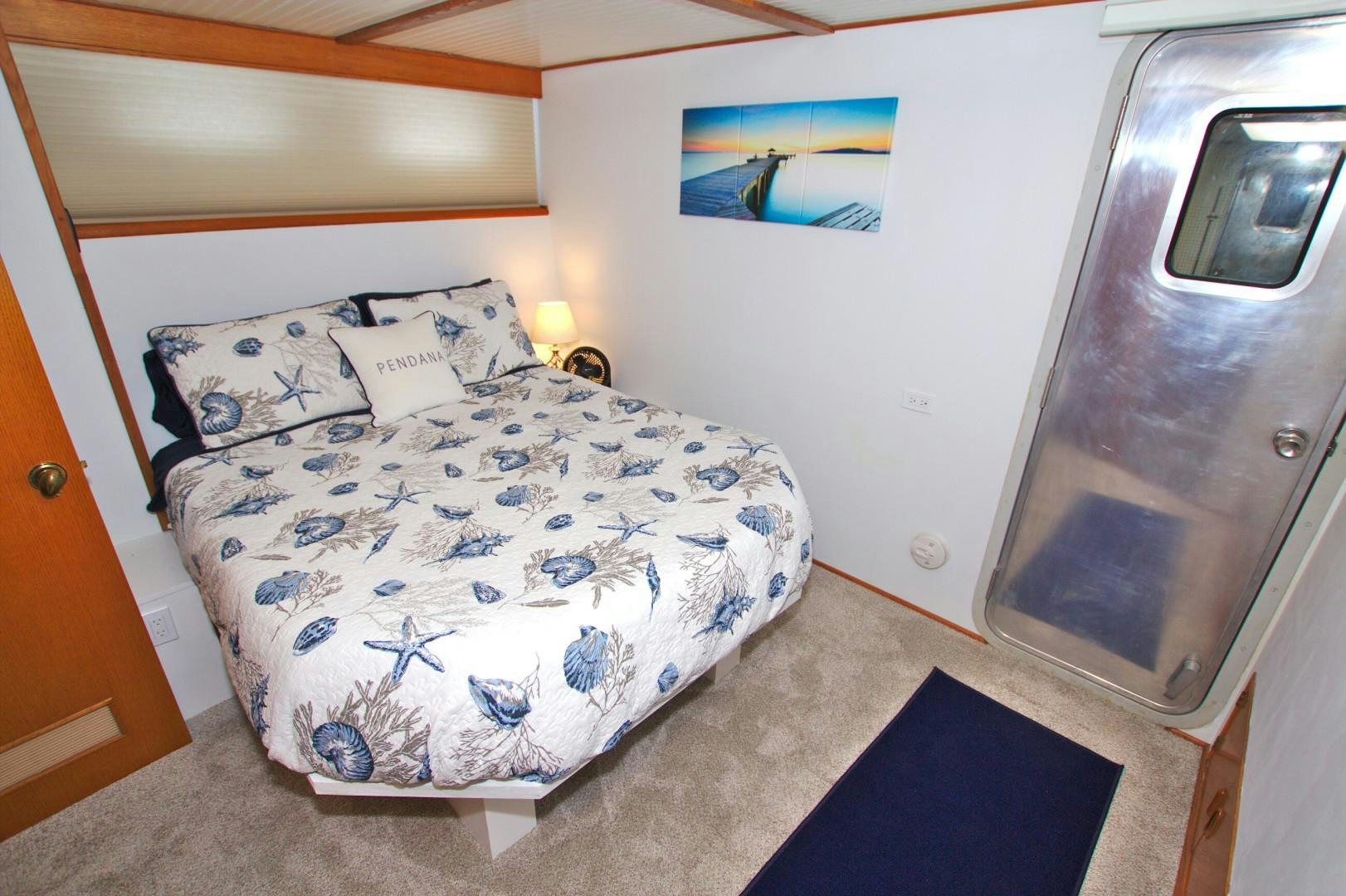 a bed in a room aboard PENDANA Yacht for Sale