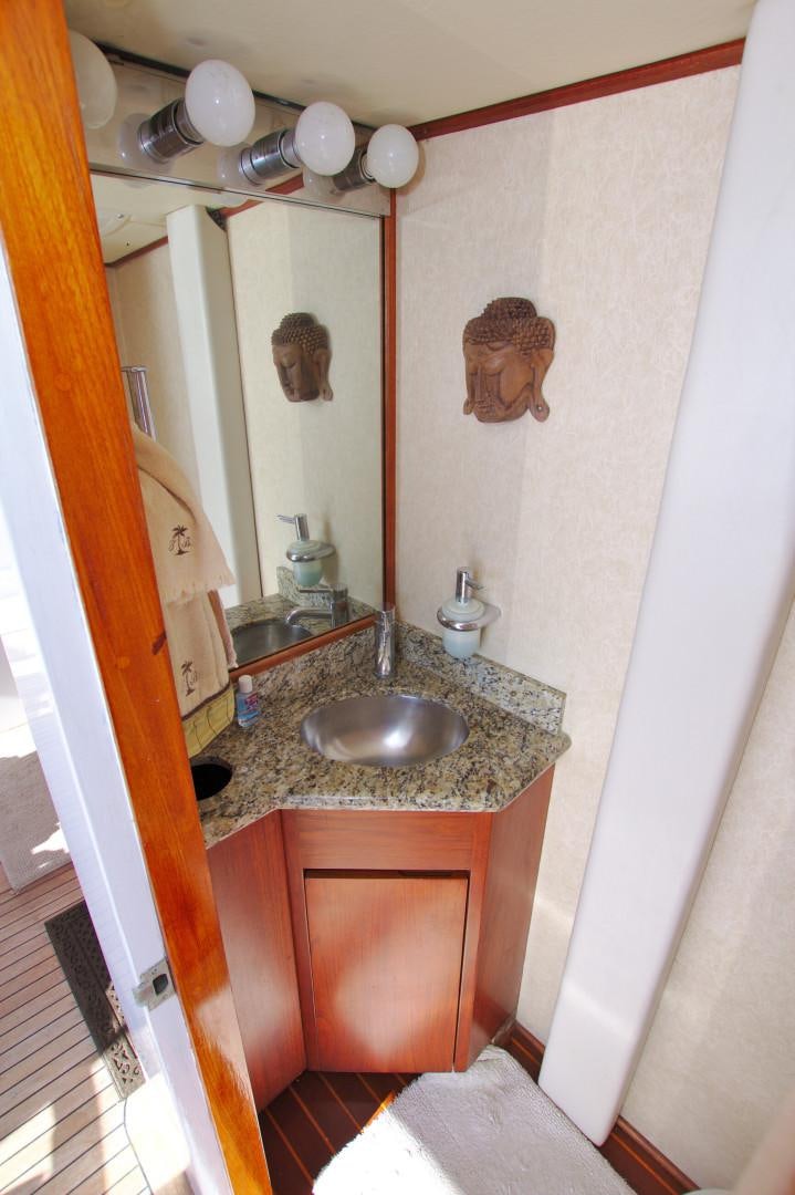 a bathroom with a sink and a mirror aboard PENDANA Yacht for Sale