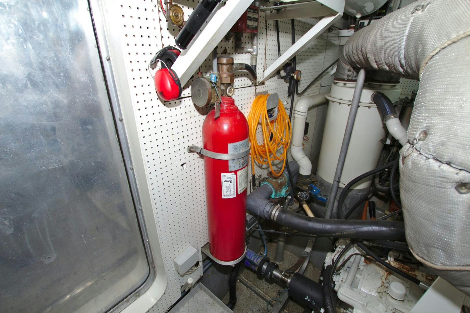 a red and white fire hydrant aboard PENDANA Yacht for Sale
