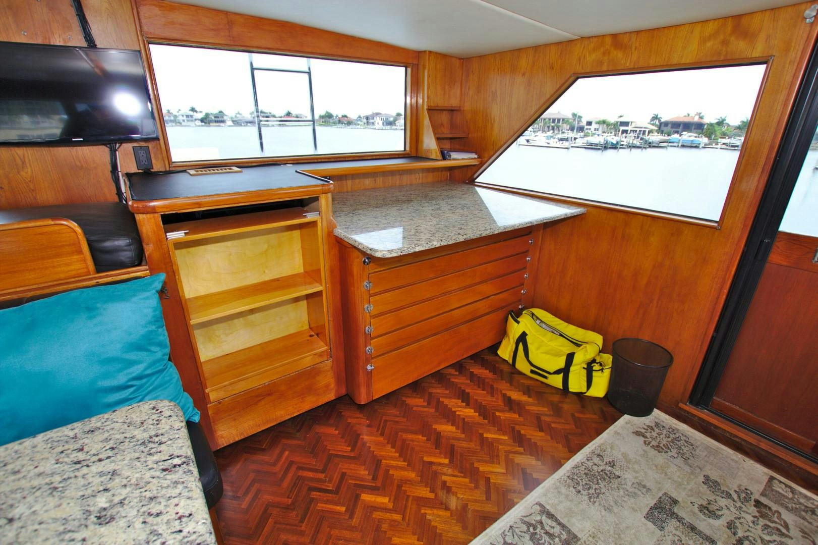 a room with a bed and a window aboard PENDANA Yacht for Sale
