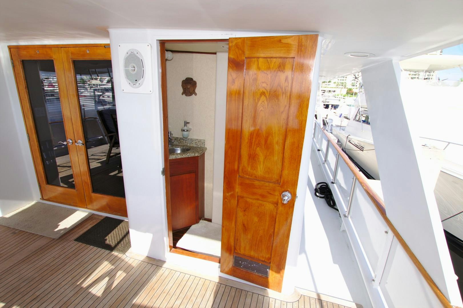a kitchen with a wood door aboard PENDANA Yacht for Sale