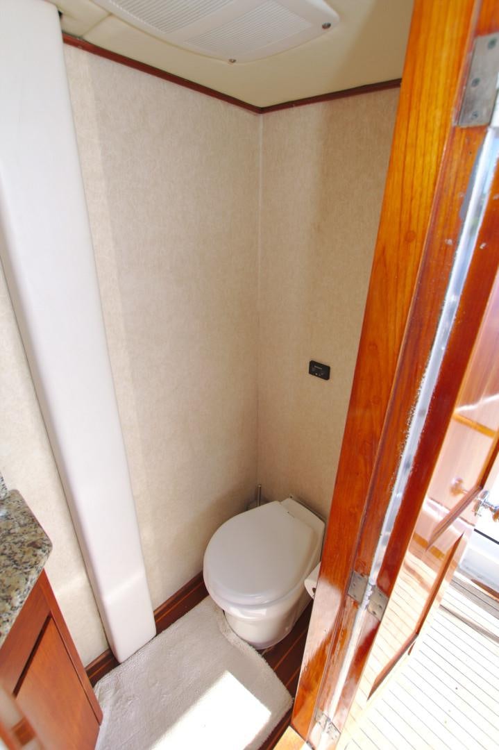 a bathroom with a toilet aboard PENDANA Yacht for Sale