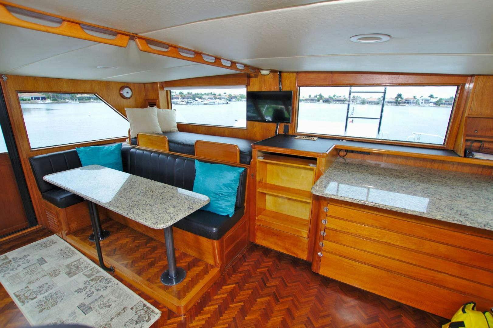 a room with a table and chairs aboard PENDANA Yacht for Sale