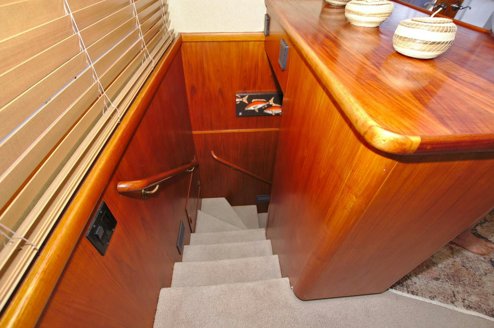 a wooden dresser with drawers aboard PENDANA Yacht for Sale