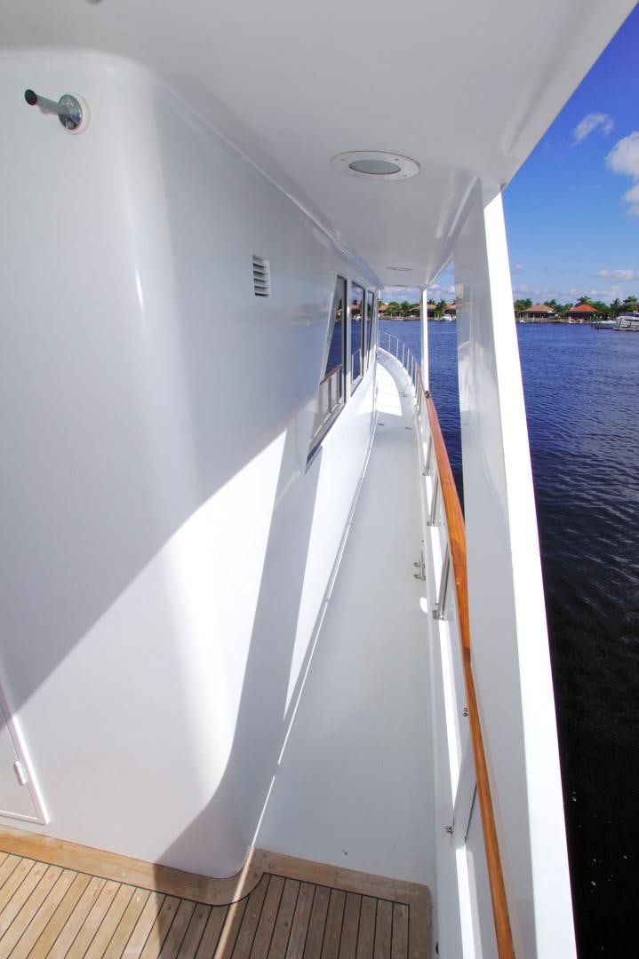 a white boat with a railing aboard PENDANA Yacht for Sale