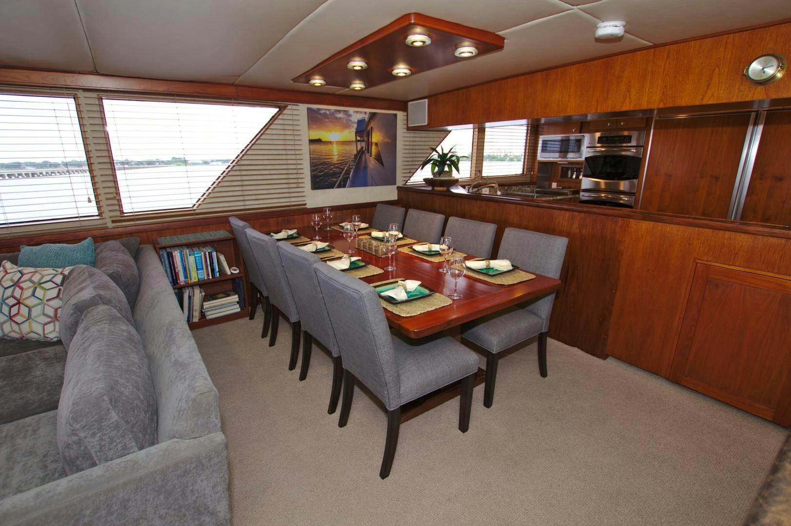 a living room with a couch and a table aboard PENDANA Yacht for Sale