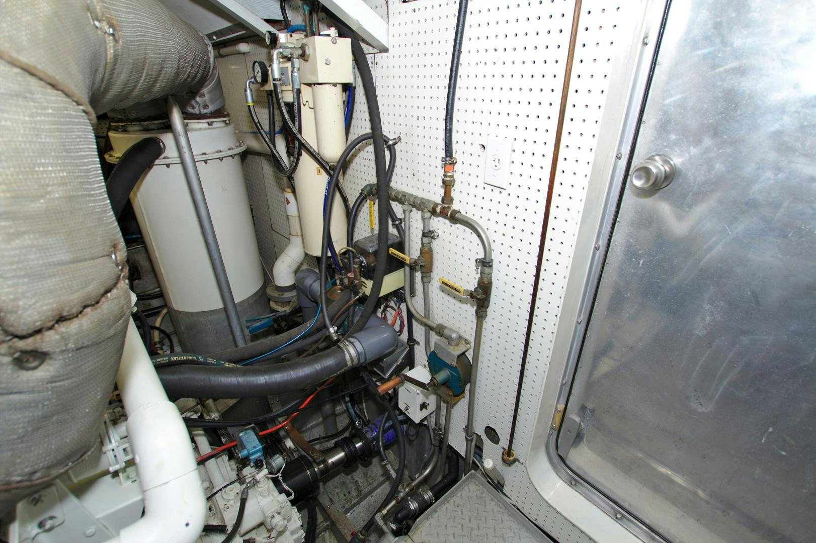 a car with a large pipe aboard PENDANA Yacht for Sale