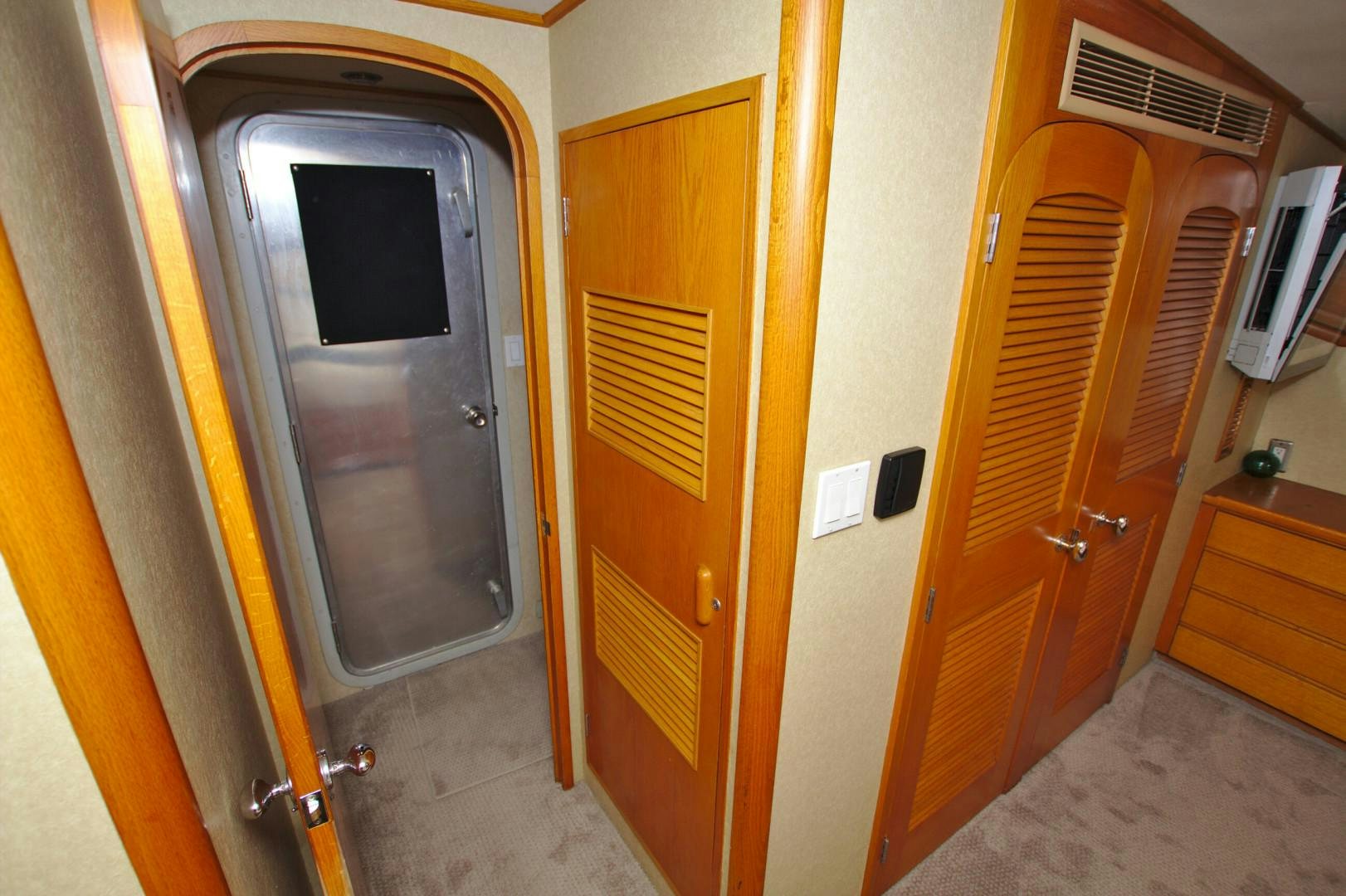 a room with wooden doors aboard PENDANA Yacht for Sale