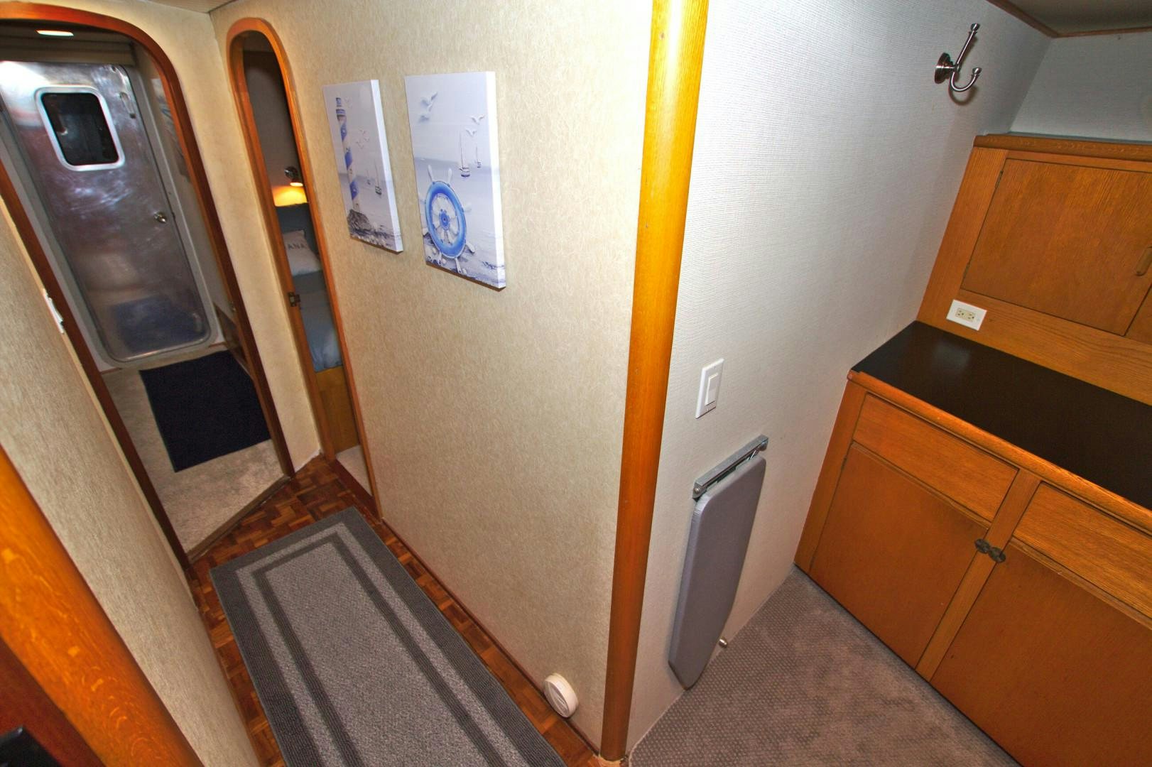 a hallway with a door and cabinets aboard PENDANA Yacht for Sale