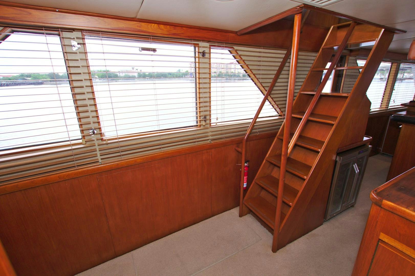 a wooden staircase in a room aboard PENDANA Yacht for Sale