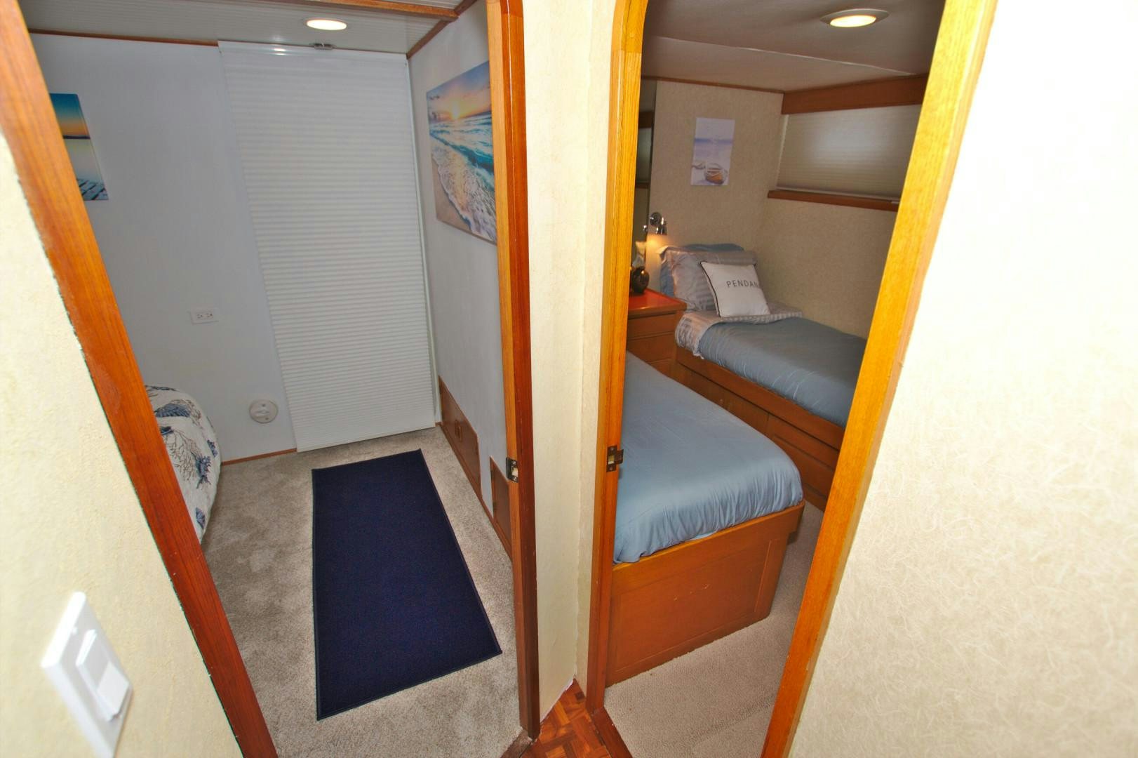 a room with a bed and a desk aboard PENDANA Yacht for Sale