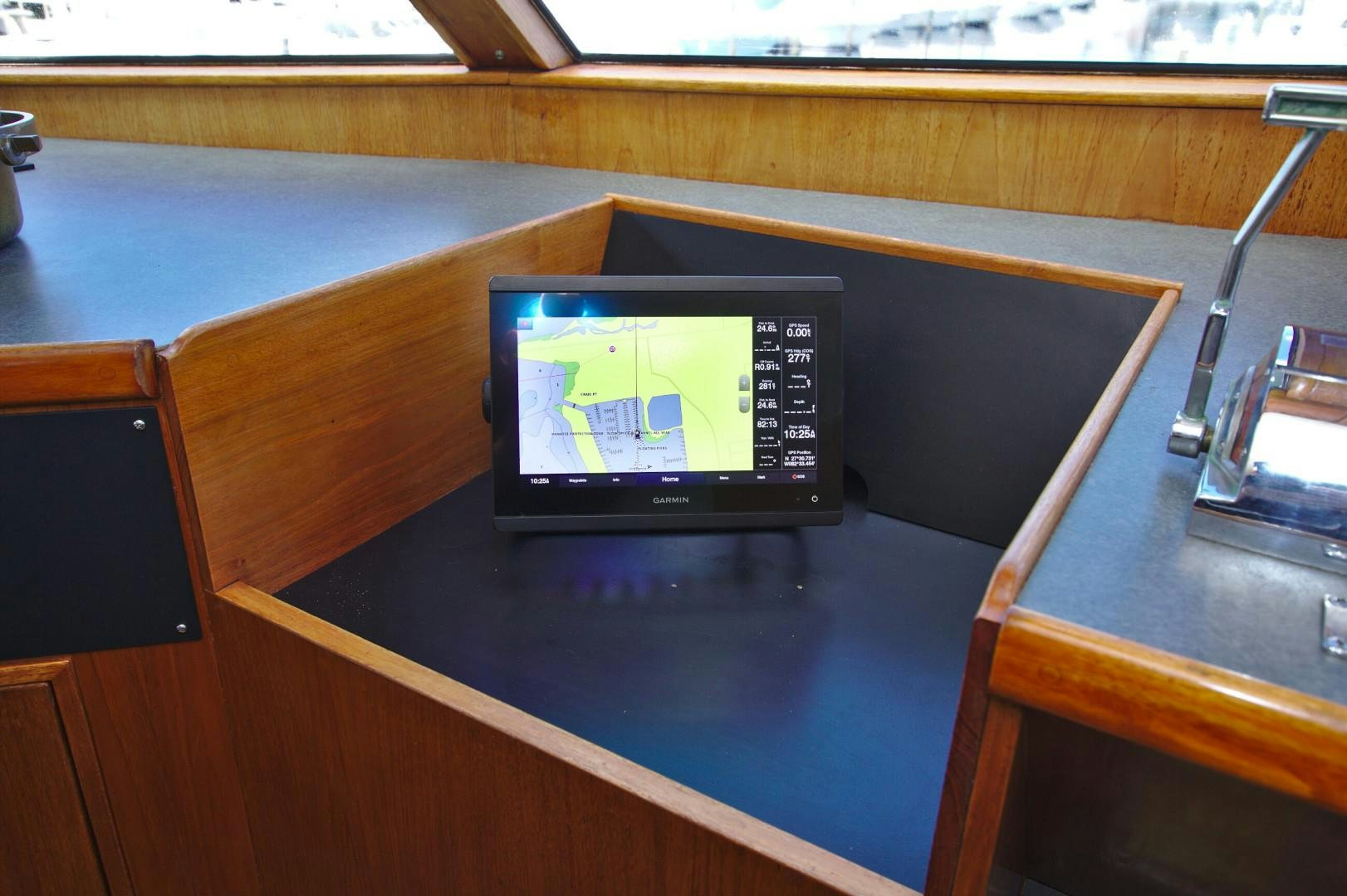 a computer on a desk aboard PENDANA Yacht for Sale