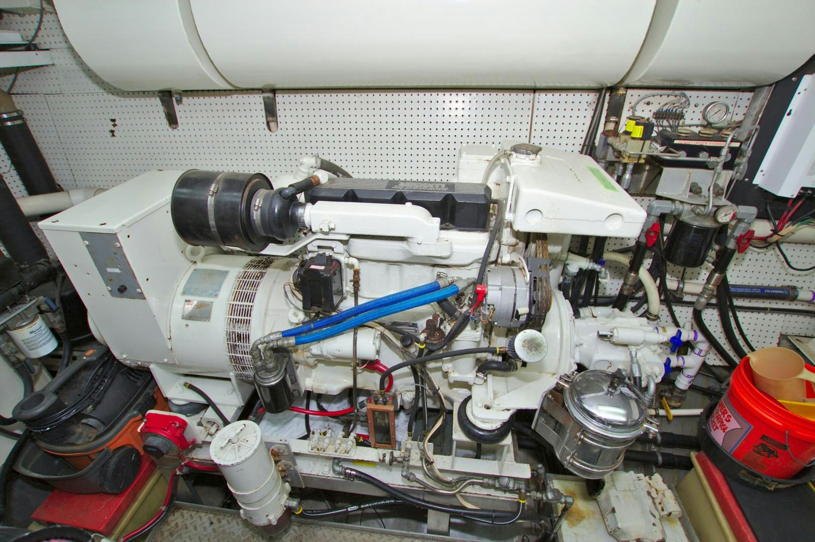 a car engine with a blue tube aboard PENDANA Yacht for Sale