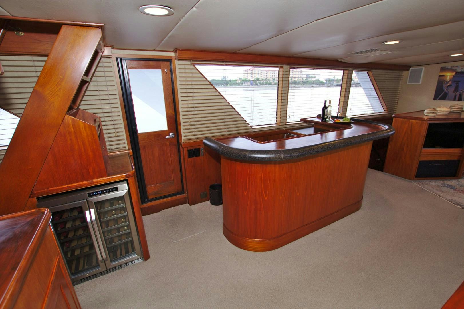 a room with a table and cabinets aboard PENDANA Yacht for Sale