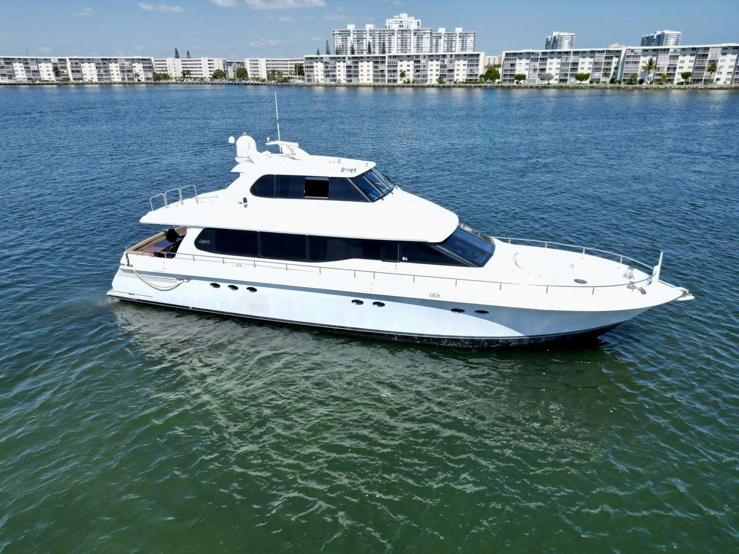 a white yacht in the water aboard CROWN JEWEL Yacht for Sale