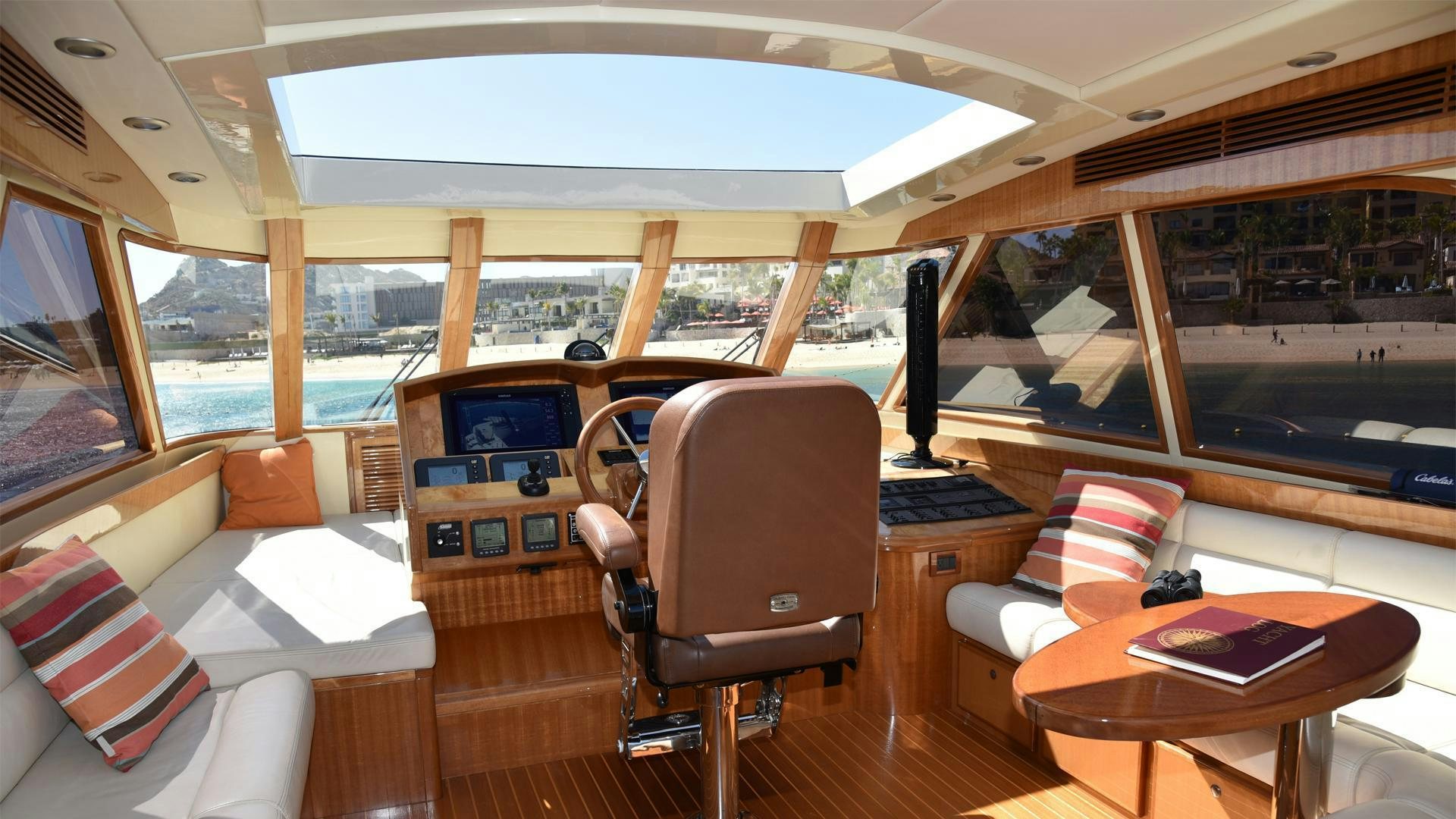 a room with a table chairs and a large window aboard CONDORS NEST Yacht for Sale