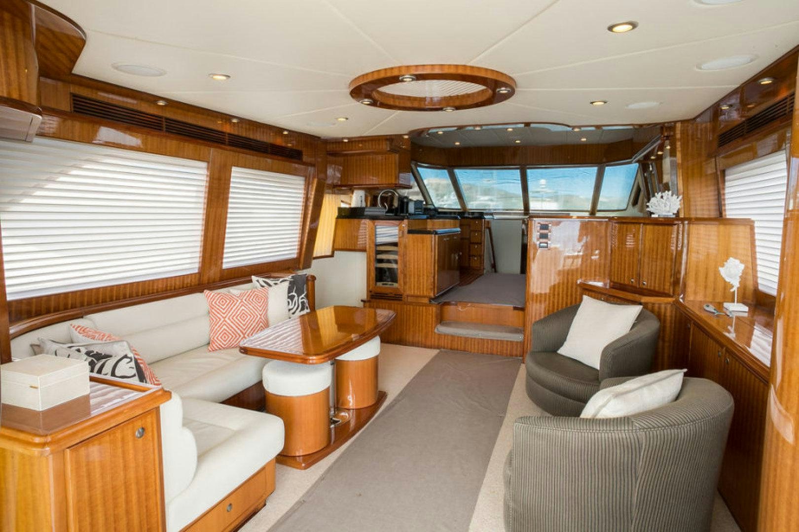 a room with a couch and a table and a chair aboard CONDORS NEST Yacht for Sale