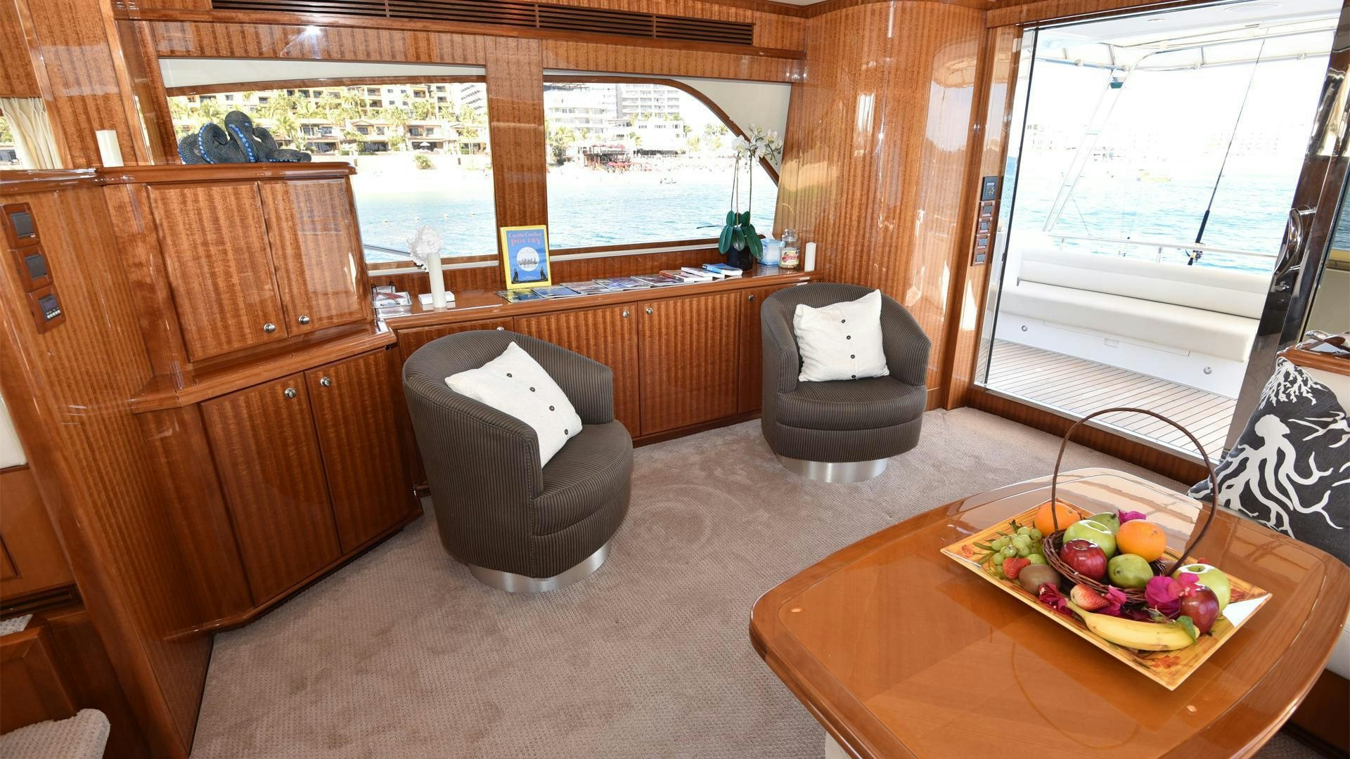 a room with a table and chairs aboard CONDORS NEST Yacht for Sale