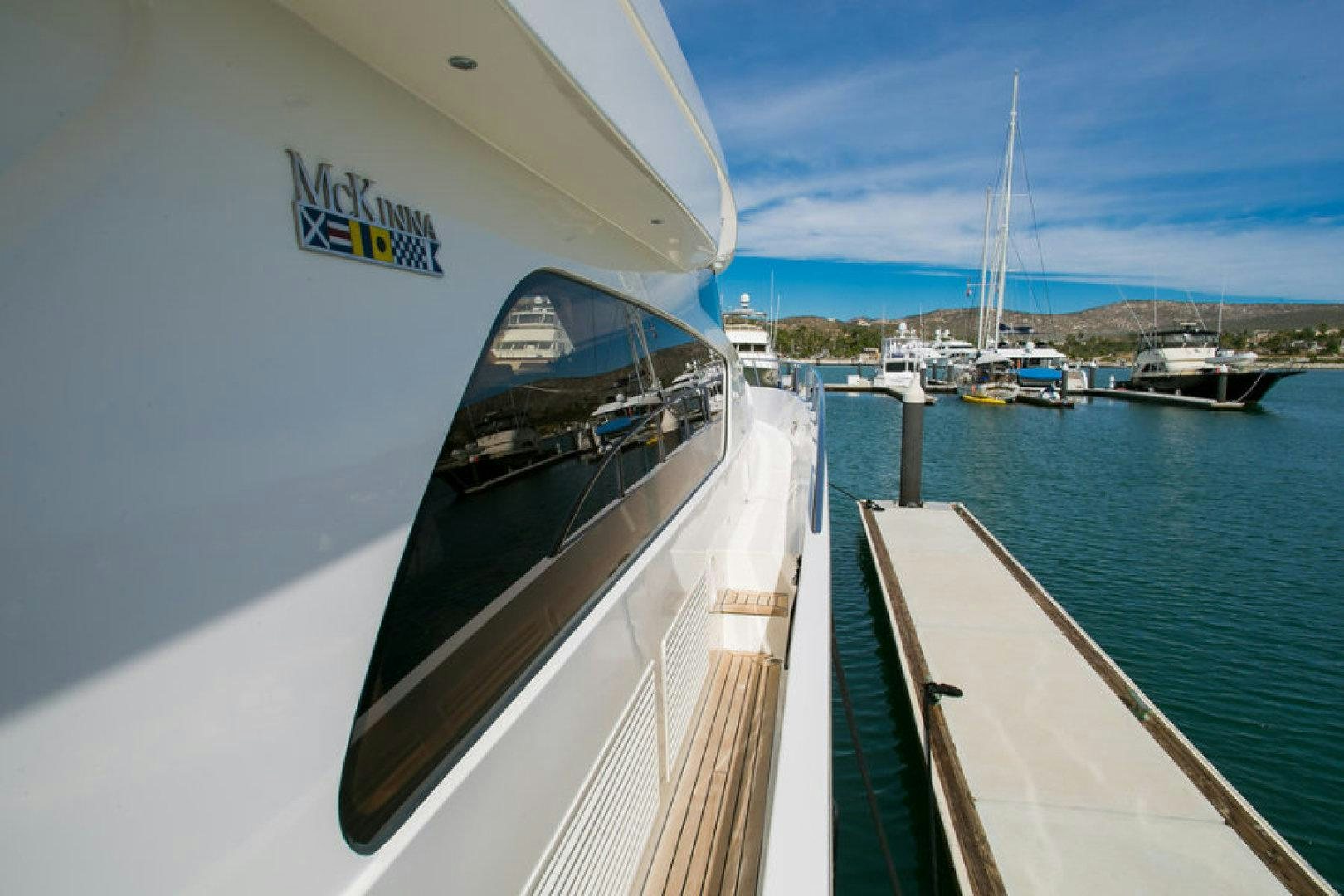 a boat is parked on the side of the water aboard CONDORS NEST Yacht for Sale