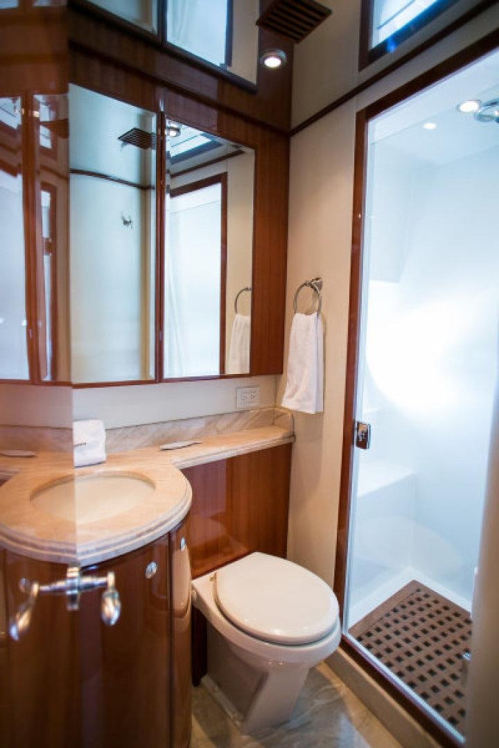 a bathroom with a sink toilet and a mirror aboard CONDORS NEST Yacht for Sale