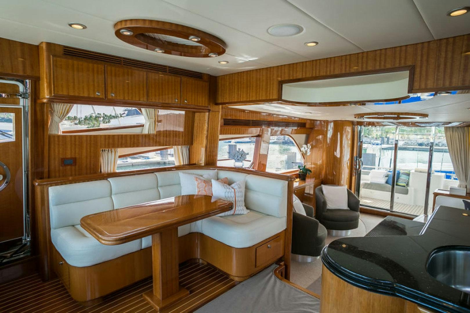 a room with a table and chairs aboard CONDORS NEST Yacht for Sale