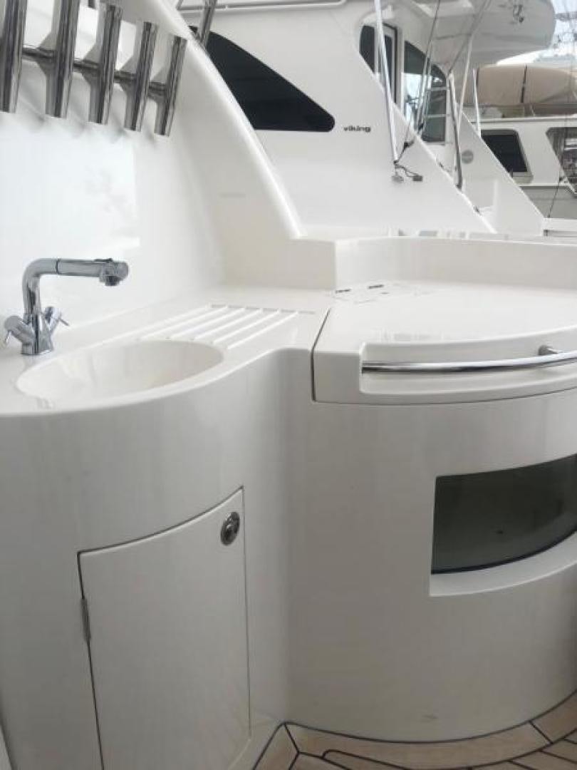 a white bathroom with a sink and a mirror aboard CONDORS NEST Yacht for Sale