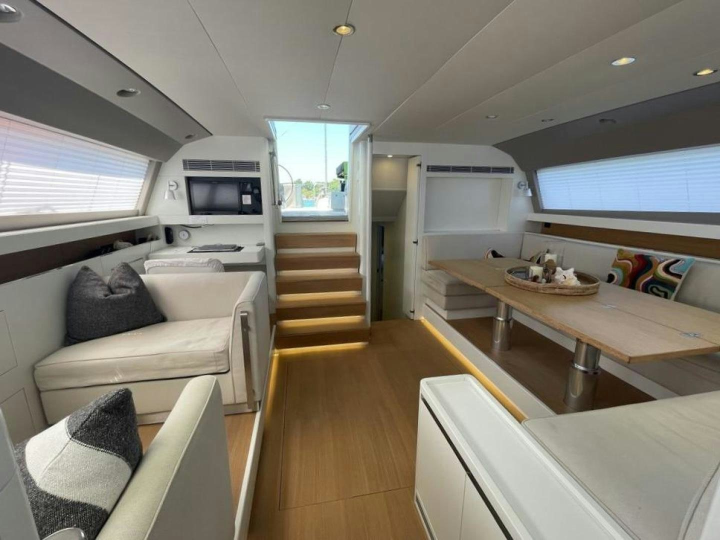 a room with a couch and a television aboard KESTREL Yacht for Sale