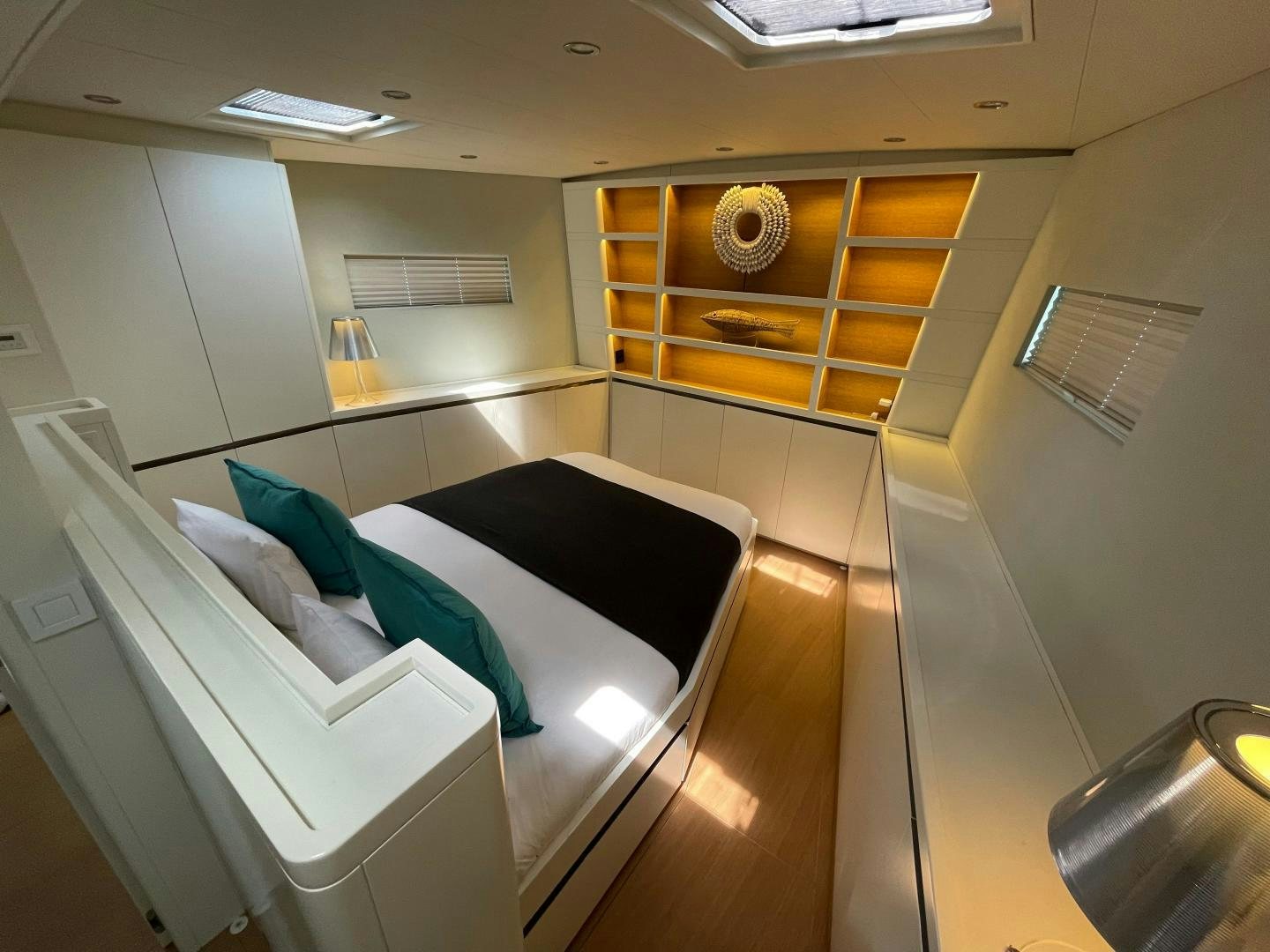 a room with a bed and a chair aboard KESTREL Yacht for Sale