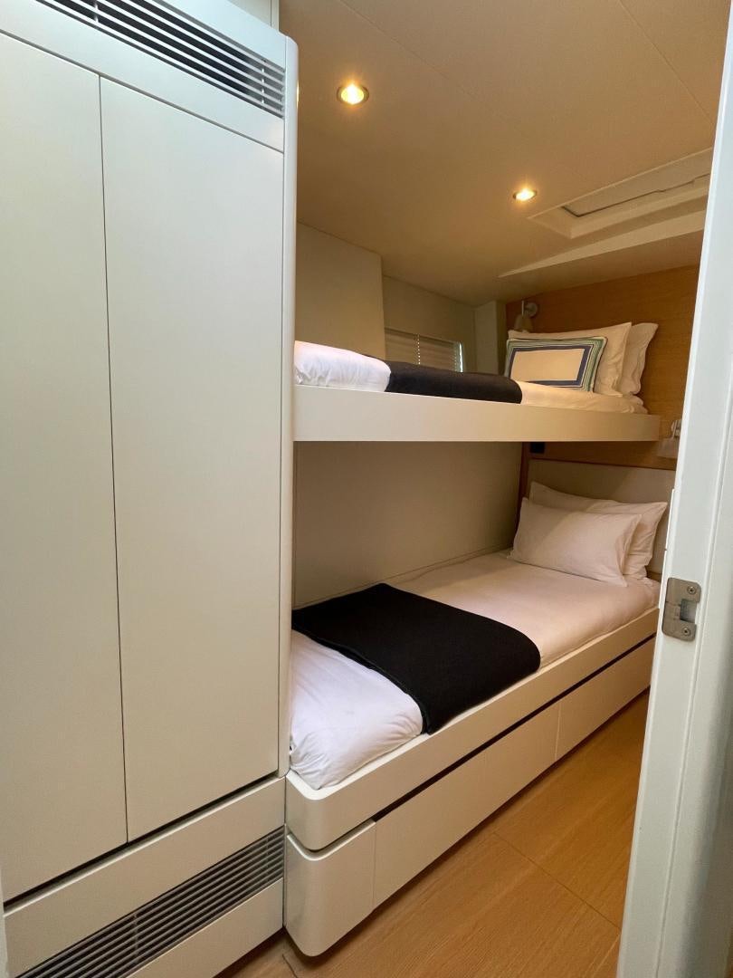 a room with a bed and a closet aboard KESTREL Yacht for Sale